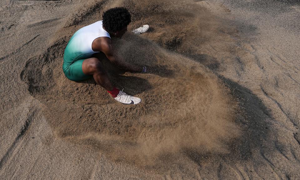 Lawrence North Omar Cooper competes in the long jump during the IHSAA Marion County Track and Field meet on Wednesday, May 11, 2022, at North Central High School in Indianapolis. 