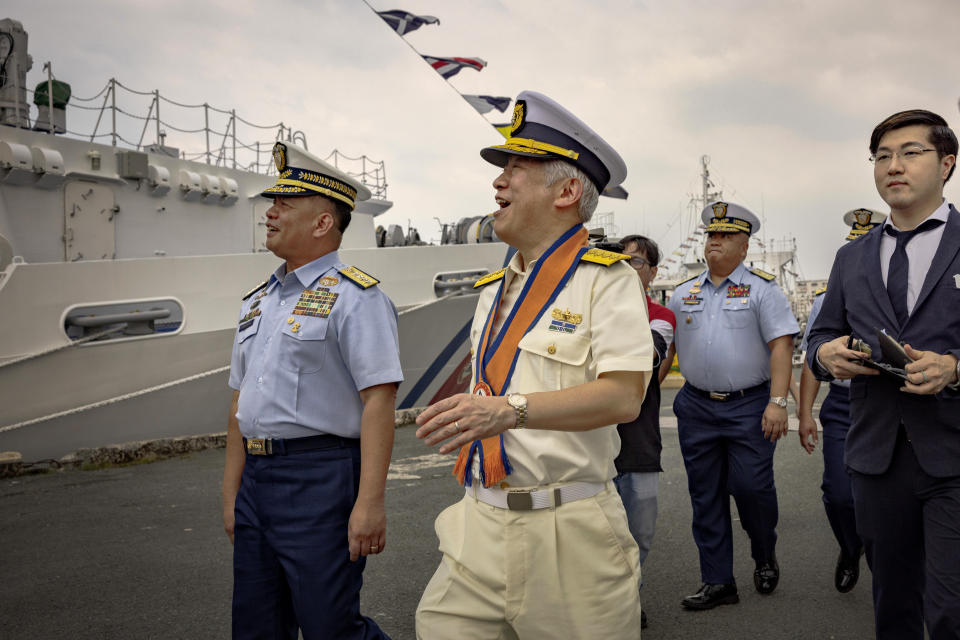 Japan Coast Guard Commandant Admiral Shohei Ishii, right, and Philippine Coast Guard Commandant Admiral Ronnie Gil Gavan, left, visit the BRP Teresa Magbanua ship at the Philippine Coast Guard headquarters on Saturday, Nov. 4, 2023 in Manila, Philippines. (Ezra Acayan/Pool Photo via AP)(