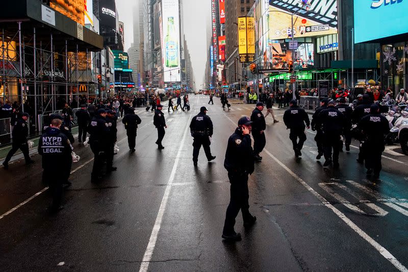 NYPD officers get ready to control protesters marching during an anti-war protest amid increased tensions between the United States and Iran at Times Square in New York