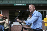 Michael Avenatti, an attorney and entrepreneur, speaks at the Hillsborough County Democrats' Summer Picnic fundraiser in Greenfield, N.H. Sunday, Aug.19, 2018. Michael Avenatti, the attorney taking on President Donald Trump over his alleged affair with an adult film actress, is exploring a possible 2020 run for president. (AP Photo/ Cheryl Senter)