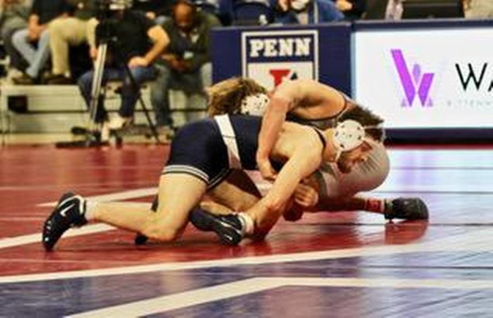 Penn State’s Creighton Edsell controls Penn’s Lucas Revano in their 165-pound bout during the Nittany Lions 20-16 come-from-behind win on Friday. Edsell’s 6-4 sudden victory win was one of two key victories Penn State needed.