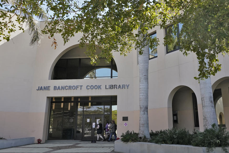 Students make their way into the Jane Bancroft Cook Library on the New College campus Friday, Jan. 20, 2023, in Sarasota, Fla. (AP Photo/Chris O'Meara)