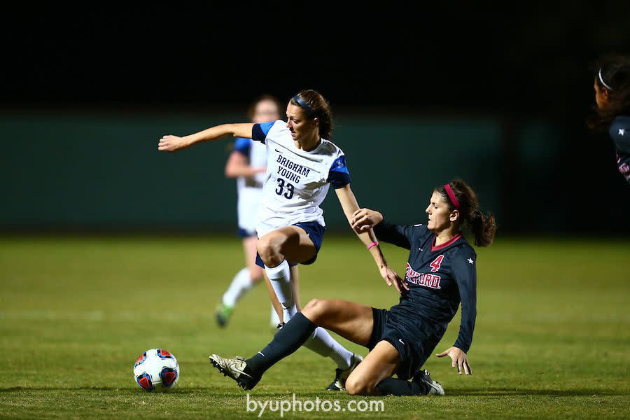 BYU’s Ashley Hatch tries to avoid a tackle during a second-round NCAA Women’s College Cup tournament game Nov. 19, 2015. Hatch recently made professional soccer history. | BYU Photo