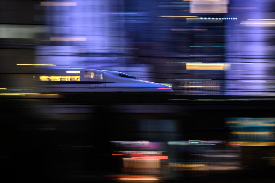 TOPSHOT - A Tokaido Shinkansen high-speed bullet train passes through the Shiodome district of Tokyo on January 21, 2024. (Photo by Philip FONG / AFP) (Photo by PHILIP FONG/AFP via Getty Images)