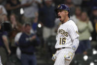 Milwaukee Brewers' Kolten Wong reacts after hitting a solo home run during the first inning of a baseball game against the New York Mets Friday, Sept. 24, 2021, in Milwaukee. (AP Photo/Aaron Gash)