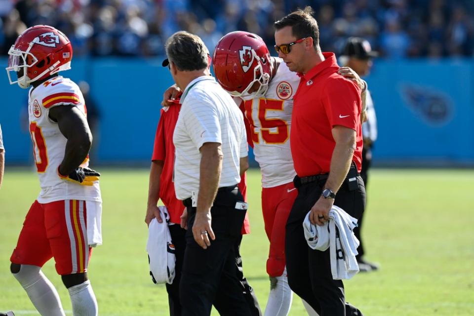 Kansas City Chiefs quarterback Patrick Mahomes (15) is helped off the field after being hit during his side’s loss to the Tennessee Titans (Mark Zaleski/AP) (AP)