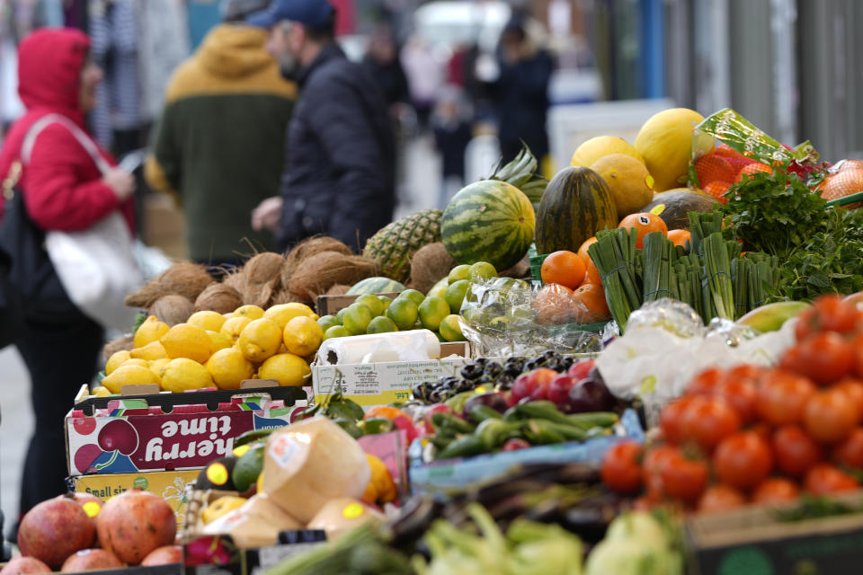 Vegetables on sale at a stall in London, Tuesday, Feb. 28, 2023. Grocery price inflation has reached a record 17.1% to add a potential £811 to annual household shopping bills. This month marks a full year since monthly grocery inflation rose beyond 4% as consumers named it their second most important issue behind energy costs. (AP Photo/Alastair Grant)