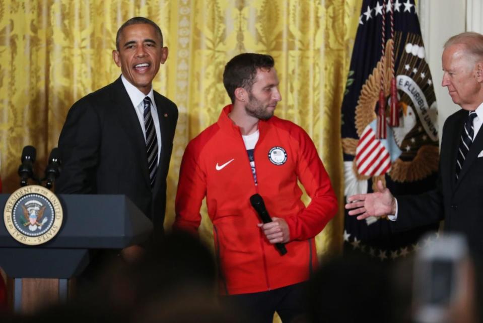 <p>Vice President Joe Biden, accompanied by President Barack Obama, reaches to shakes hands with Paralympic closing ceremony flag bearer Army veteran Josh Brunais, during a ceremony in the East Room of the White House in Washington, Thursday, Sept. 29, 2016, where the president honored members of the 2016 United States Summer Olympic and Paralympic Teams. (AP Photo/Manuel Balce Ceneta)</p>