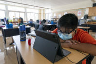 A student works at his desk at the Post Road Elementary School during the coronavirus outbreak, Thursday, Oct. 1, 2020, in White Plains, N.Y. (AP Photo/Mary Altaffer)