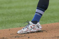 St. Louis Cardinals starting pitcher Jack Flaherty (22) wears cleats supporting the Black Lives Matter movement during the first inning of a baseball game against the Cleveland Indians, Saturday, Aug. 29, 2020, in St. Louis. (AP Photo/Scott Kane)