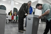 A ballot box is officially sealed by head of the election committee Istvan Suto-Nagy, left, and committee member Judit Nagy at the start of the nationwide local elections in Budapest, Hungary, Sunday, Oct. 13, 2019. (Szilard Koszticsak/MTI via AP)