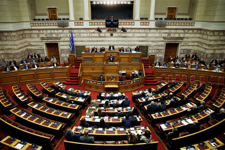 Greek Prime Minister Alexis Tsipras addresses lawmakers during a parliamentary session before a vote on German World War II reparations in Athens, Greece April 17, 2019. REUTERS/Costas Baltas