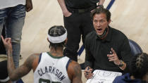 Utah Jazz coach Quin Snyder speaks with guard Jordan Clarkson (00) during a timeout in the second half of the team's NBA basketball game against the San Antonio Spurs on Wednesday, May 5, 2021, in Salt Lake City. (AP Photo/Rick Bowmer)