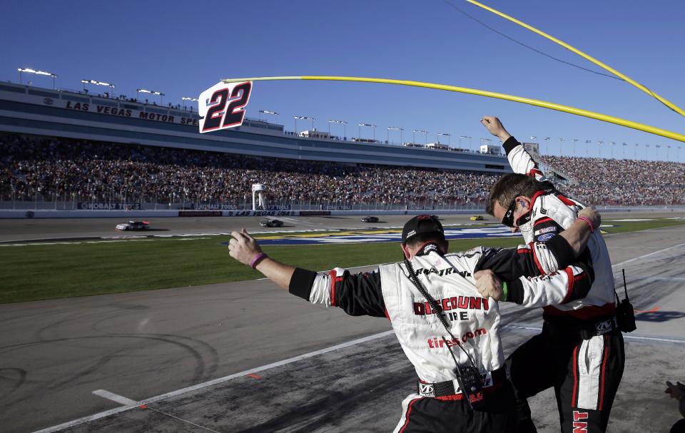 Crew members celebrate as Brad Keselowski, left, wins the NASCAR Nationwide Series auto race Saturday, March 8, 2014, in Las Vegas. (AP Photo/Isaac Brekken)