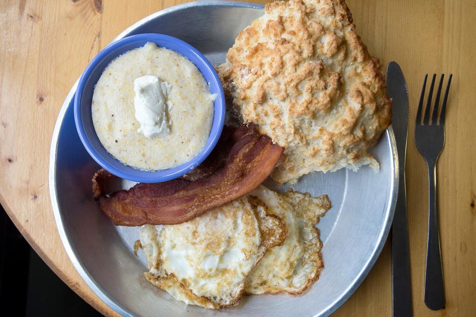 At Biscuit Head's Biltmore location, guests can order a full breakfast, which comes with two eggs whichever way, a biscuit, and two sides. Sides include, grits, bacon, country ham, coconut collards, and much more.