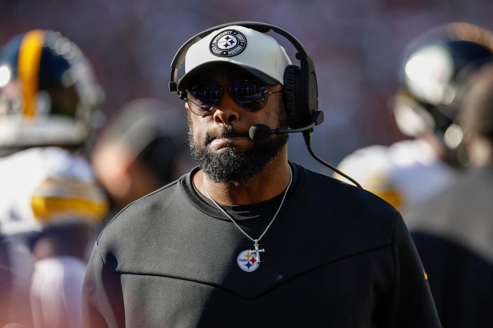 Pittsburgh Steelers head coach Mike Tomlin walks on the sidelines during the first half of an NFL football game against the Cleveland Browns, Sunday, Nov. 19, 2023, in Cleveland. (AP Photo/Ron Schwane)
