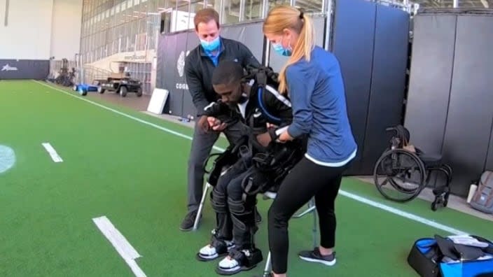 Corey Borner, who was paralyzed in 2009, is inspiring doctors as he uses an exoskeleton suit to give him a mechanical boost to exercise his muscles. (Photo: Screenshot/nbcdfw.com)