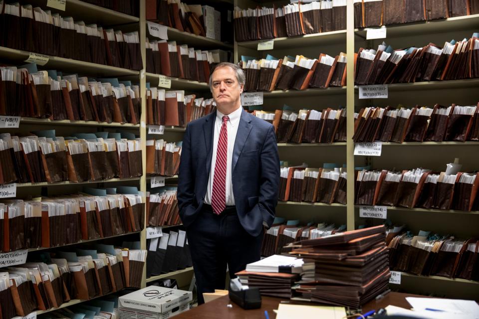 In this photo from 2020, Rob Bilott stands in his document room in the downtown Cincinnati office of the Taft law firm, where he is a partner. Bilott is an environmental lawyer who has spent much of his career suing chemical companies.