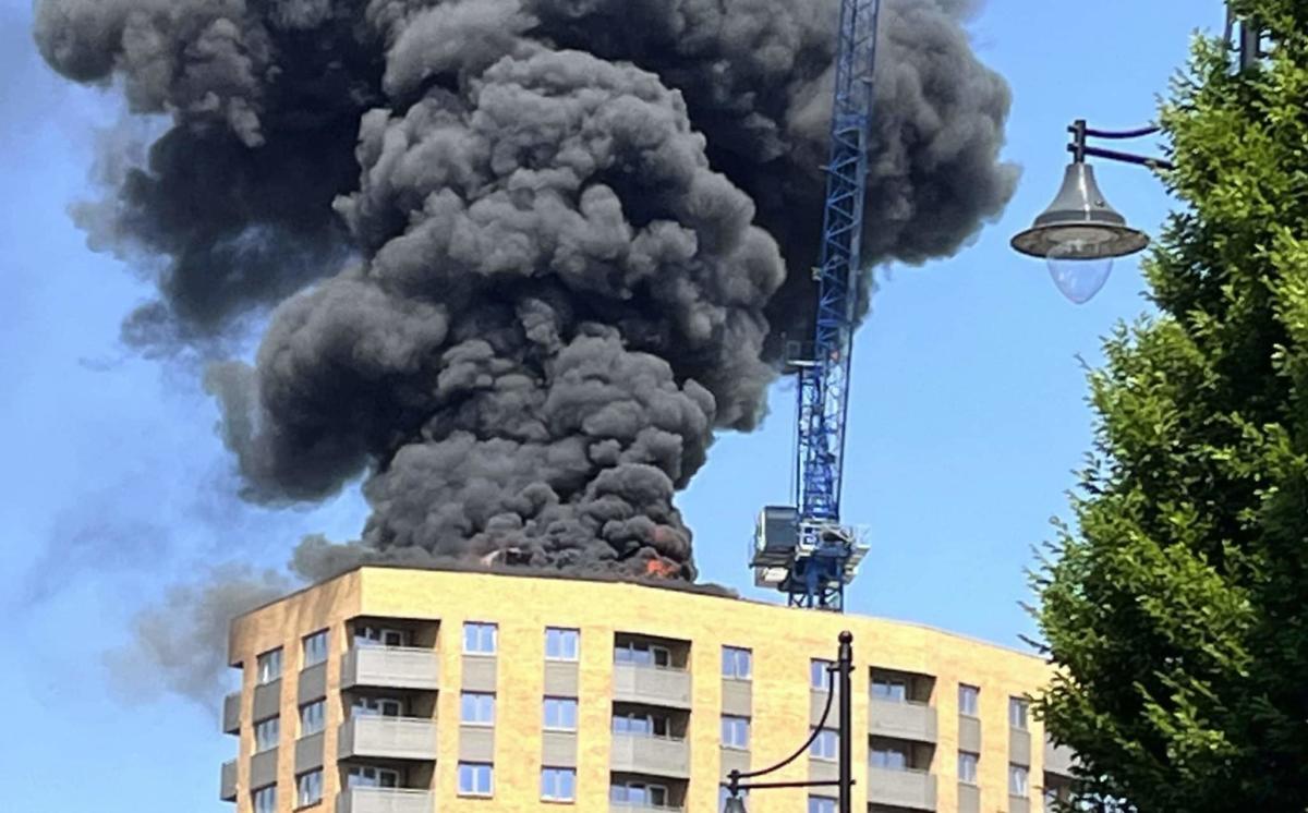 Large fire breaks out at tower block in Surrey