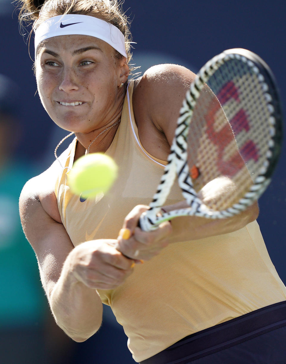 Aryna Sabalenka, of Belarus, hits a backhand to Zheng Saisai, of China, during the finals of the Mubadala Silicon Valley Classic tennis tournament in San Jose, Calif., Sunday, Aug. 4, 2019. (AP Photo/Tony Avelar)