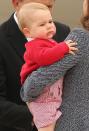 <p>George, 9 months, makes a face while his mother Kate Middleton holds him at Fairbairne Airbase in Australia. The little prince joined the Duke and Duchess of Cambridge for his first royal trip that year and took a three-week tour of Australia and New Zealand.</p>