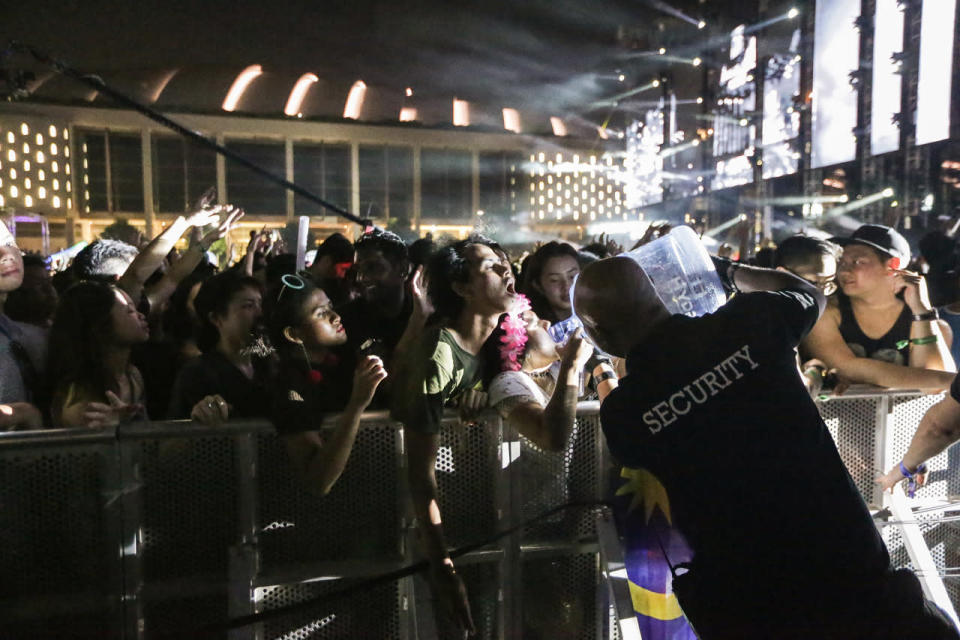 Security guards keeping festivalgoers hydrated at Ultra Singapore. (Photo: Yahoo Singapore)