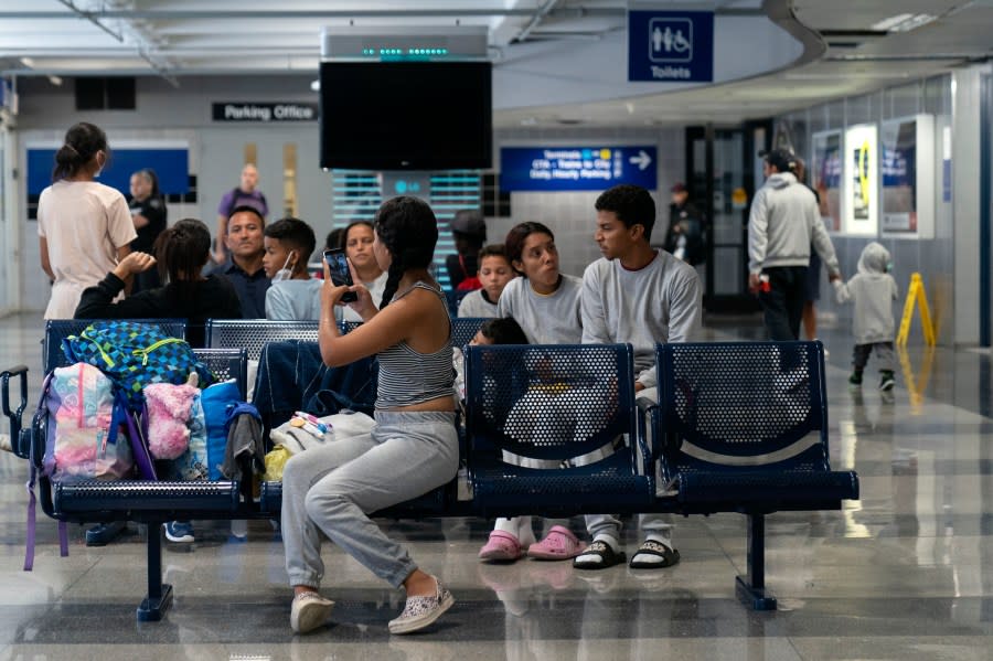 Run by a private firm hired by the city, migrants stay in a makeshift shelter at O’Hare International Airport, Wednesday, Sept. 20, 2023, in Chicago. Unlike migrants in the public eye at police stations, the migrants at O’Hare and a handful at Midway International Airport have limited access to resources, including showers and medical care. (AP Photo/Erin Hooley)