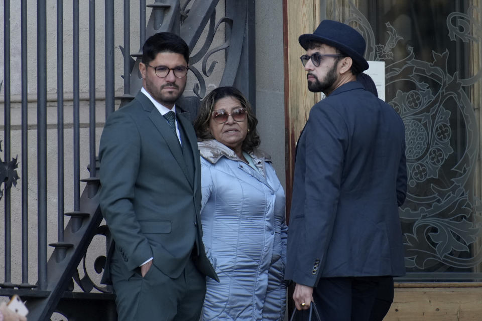 Brazilian soccer star Dani Alves' mother Lucia, centre stands outside the court before the start of a trial in Barcelona, Spain, Monday, Feb. 5, 2024. Dani Alves is on trial for allegedly sexually assaulting a young woman at a Barcelona night club in December 2022 and has spent the past year in pre-trial jail after his bail requests were rejected. He denies any wrongdoing. (AP Photo/Emilio Morenatti)
