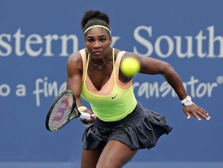 Serena Williams (USA) charges the net to return a shot against Tsventana Pironkova (not pictured) on day five during the Western and Southern Open tennis tournament at Linder Family Tennis Center. Mandatory Credit: Aaron Doster-USA TODAY Sports