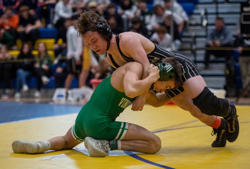 Ty Henderson of Vincennes Lincoln and Brady Byrd of Washington compete in the 106-pound championship match during the 2023 IHSAA Regional Wrestling tournament at Castle High School in Newburgh, Ind., Saturday afternoon, Feb. 4, 2023.