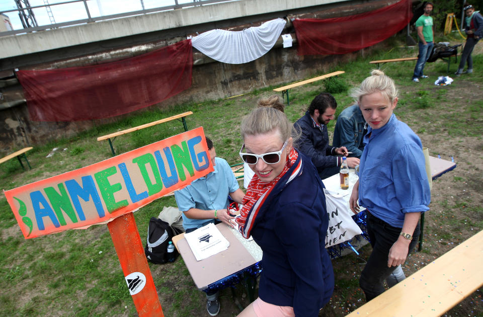 BERLIN, GERMANY - JULY 21: Attendees sign up to compete at the second annual Hipster Olympics on July 21, 2012 in Berlin, Germany. With events such as the "Horn-Rimmed Glasses Throw," "Skinny Jeans Tug-O-War," "Vinyl Record Spinning Contest" and "Cloth Tote Sack Race," the Hipster Olympics both mocks and celebrates the Hipster subculture, which some critics claim could never be accurately defined and others that it never existed in the first place. The imprecise nature of determining what makes one a member means that the symptomatic elements of adherants to the group vary in each country, but the archetype of the version in Berlin, one of the more popular locations for those following its lifestyle, along with London and Brooklyn, includes a penchant for canvas tote bags, the carbonated yerba mate drink Club Mate, analogue film cameras, asymetrical haircuts, 80s neon fashion, and, allegedly, a heavy dose of irony. To some in Berlin, members of the hipster "movement" have replaced a former unwanted identity in gentrifying neighborhoods, the Yuppie, for targets of criticism, as landlords raise rents in the areas to which they relocate, particularly the up-and-coming neighborhood of Neukoelln. (Photo by Adam Berry/Getty Images)