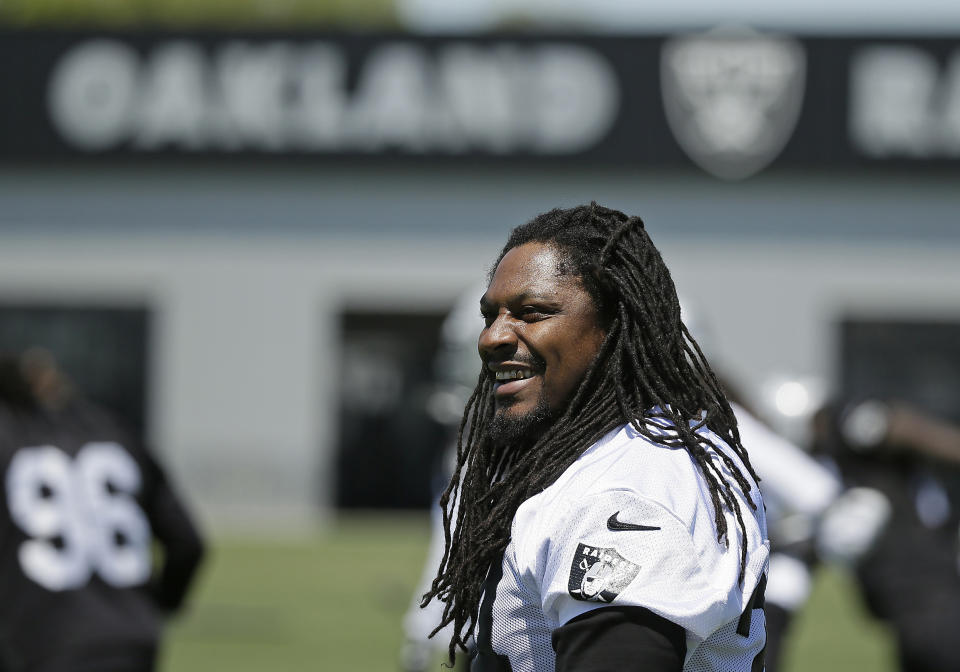 FILE - In this May 23, 2017, file photo, Oakland Raiders running back Marshawn Lynch stretches during NFL football practice in Alameda, Calif. Oakland may always be home for Lynch but Seattle was the city that truly made him a star. The Seahawks (2-3) will get an up-close look at Lynch again this week for the first time since he retired following the 2015 season when they travel to London to face the Raiders (1-4).  (AP Photo/Eric Risberg, File)