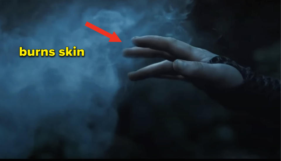 Katniss reaching her hand out to touch the poison gas cloud "with the caption "poison gas"