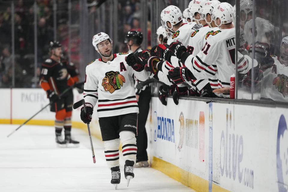 Chicago Blackhawks' Tyler Johnson (90) celebrates after his goal with teammates during the first period of an NHL hockey game against the Anaheim Ducks, Monday, Feb. 27, 2023, in Anaheim, Calif. (AP Photo/Jae C. Hong)