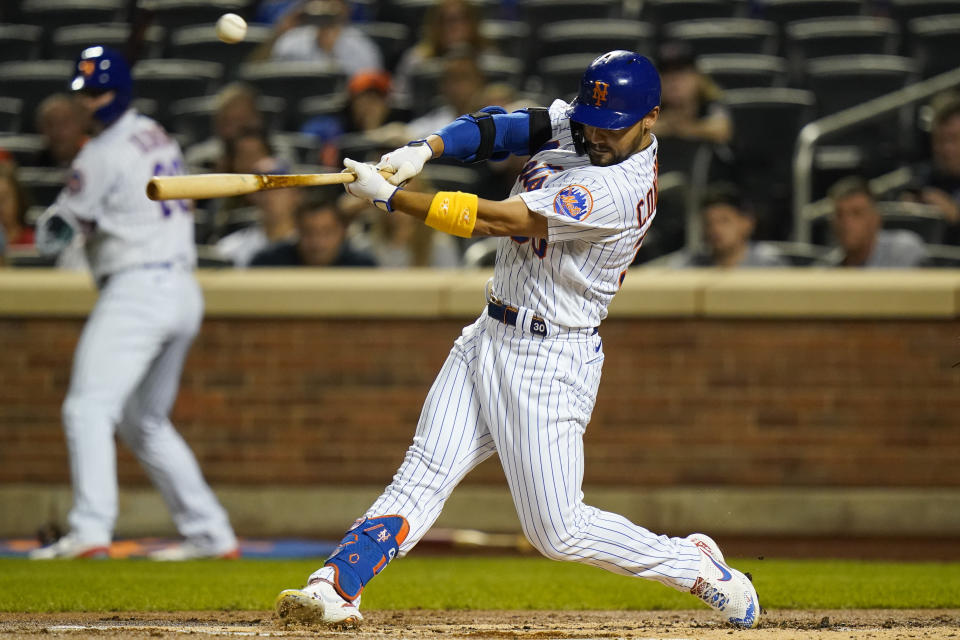 New York Mets' Michael Conforto hits an RBI single during the first inning of the team's baseball game against the St. Louis Cardinals on Tuesday, Sept. 14, 2021, in New York. (AP Photo/Frank Franklin II)