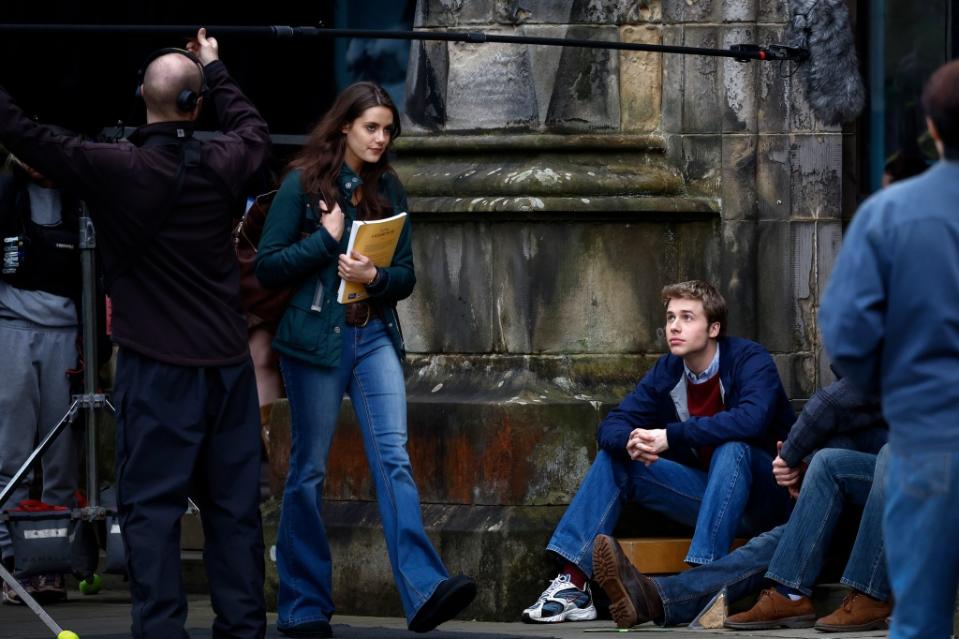 ST ANDREWS, SCOTLAND - MARCH 17: Actor Ed McVey, as Prince William and actress Meg Bellamy, who plays Kate Middleton are seen during filming for the next season of The Crown in St Andrews, on March 17, 2023 in St Andrews, Scotland. The sixth series of the drama, based on the real lives of the recent British monarchy, is set in St Andrews where the Prince and Princess of Wales met whilst studying at University. (Photo by Jeff J Mitchell/Getty Images)