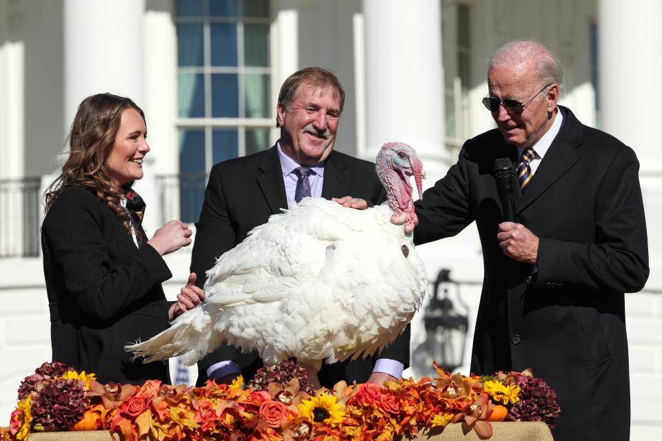 President Joe Biden pardons Chocolate, the National Thanksgiving Turkey, as he is joined by the 2022 National Turkey Federation Chairman Ronnie Parker and Alexa Starnes, daughter of the owner of Circle S Ranch, on the South Lawn of the White House November 21, 2022 in Washington, DC.