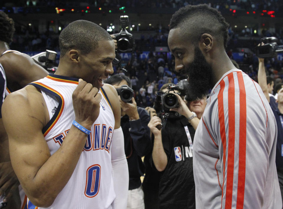 Oklahoma City Thunder guard Russell Westbrook (0) and Houston Rockets guard James Harden, right, talk following their an NBA basketball game in Oklahoma City, Wednesday, Nov. 28, 2012. Oklahoma City won 120-98. (AP Photo/Sue Ogrocki)