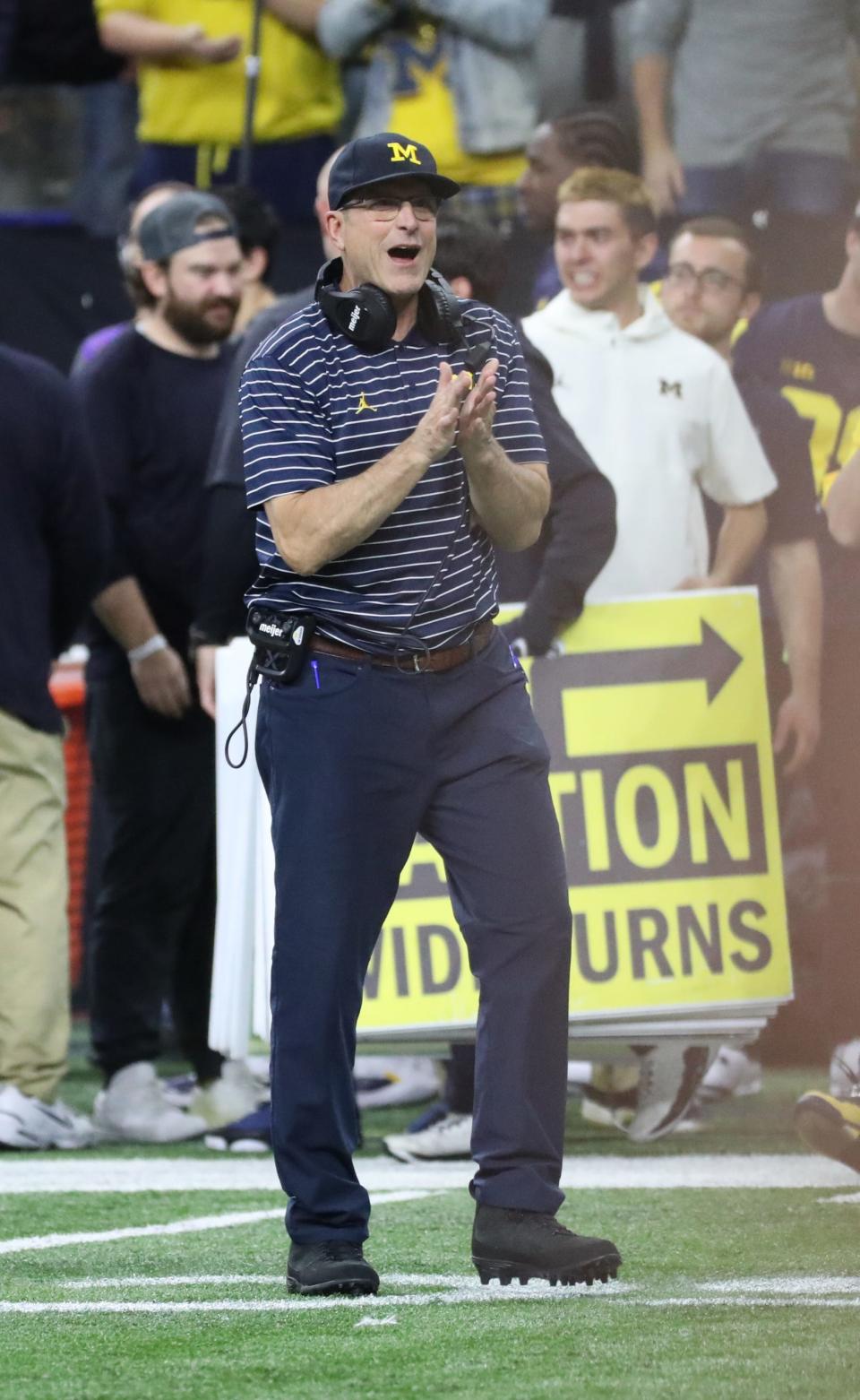Michigan Wolverines head coach Jim Harbaugh celebrates the 43-22 win against the Purdue Boilermakers in the Big Ten championship game at Lucas Oil Stadium in Indianapolis, Saturday, Dec. 3, 2022.
