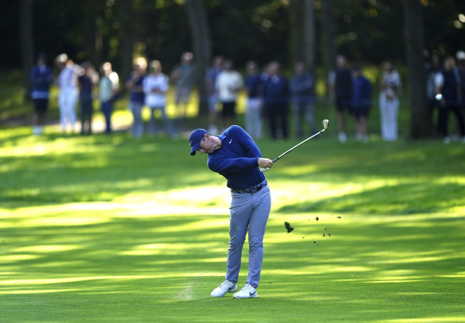 Northern Ireland's Rory McIlroy tees off on the third, during day one of the PGA Championship at Wentworth Golf Club in Virginia Water, Surrey, England, Thursday, Sept. 14, 2023. (Zac Goodwin/PA via AP)