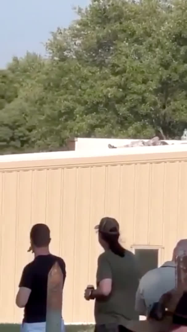Video screenshot showing alleged sniper who shot Donald Trump at a rally, dead on a roof