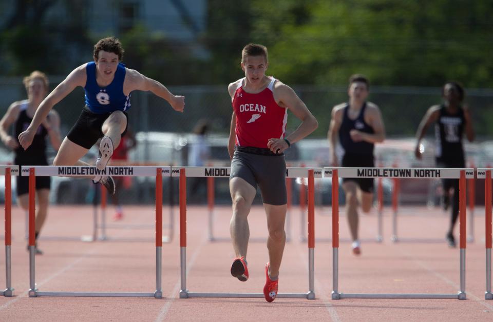 Shore Regional's Aidan Scaturro (left) challenges Ocean High's Alex Sadikov in the 400 hurdles at last month's Monmouth County meet