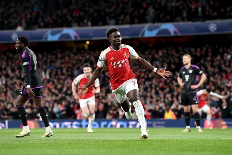 Bukayo Saka curled a beautiful shot around Manuel Neuer for an early lead (Arsenal FC via Getty Images)