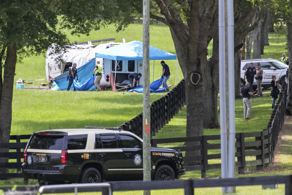 Authorities work at the scene of a deadly crash after a bus carrying farmworkers collided with a pickup truck on State Road 40 Tuesday, May 14, 2024, near Dunnellon, Fla. (AP Photo/Alan Youngblood)