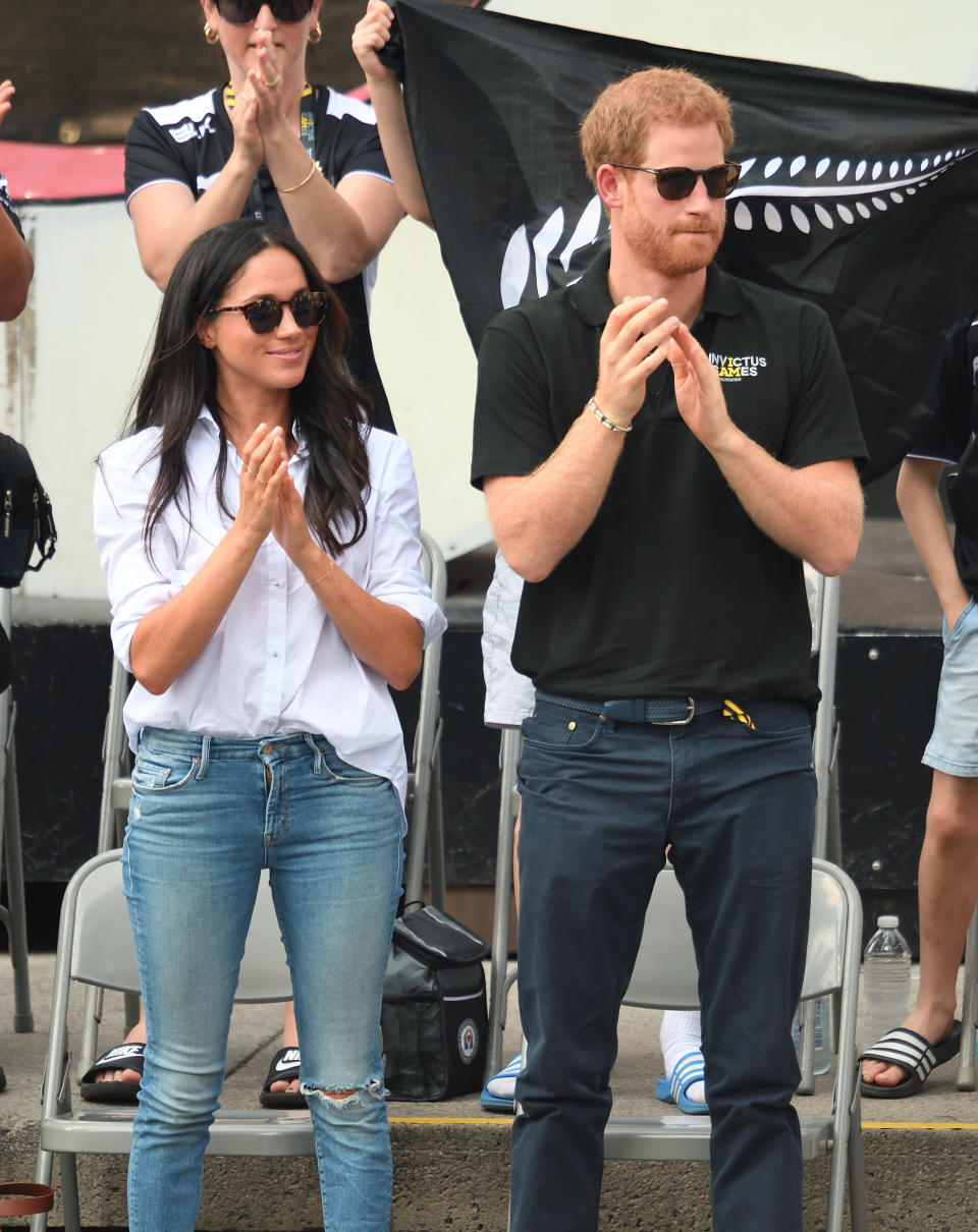 Markle was spotted in white during her and Prince Harry's first public appearance as a couple at the Invictus Games 2017 in Toronto, Canada. She paired the casual button-down top with ripped blue jeans. (Photo: Getty Images)