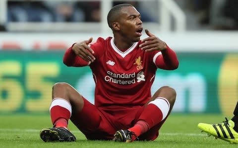 Daniel Sturridge sits on the pitch in frustration - Credit: Getty Images