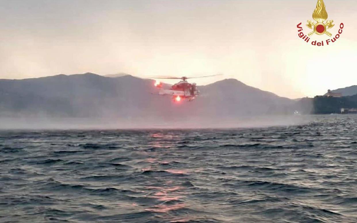 A helicopter search for missing after a tourist boat capsized - Vigili Del Fuoco via AP