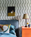<p> This pretty and delicate oak leaf botanical print from Common Room is a wonderful example of a small scale wallpaper that feels perfectly suited to a bedroom.  </p> <p> It has a classic, timeless feel, which when combined with a relaxed denim blue linen upholstered bed and vibrant orange lacquer bedside cabinet makes for a truly unique and fresh look.  </p> <p> The gentle, pared-back design allows the bold use of colour elsewhere to not overwhelm the room. All the different bedroom color ideas work happily together in harmony.  </p> <p> The tactile nature of the textile artwork, contemporary applique cushion, linen headboard and woven lampshade all add to the welcoming and cosy feel. </p>
