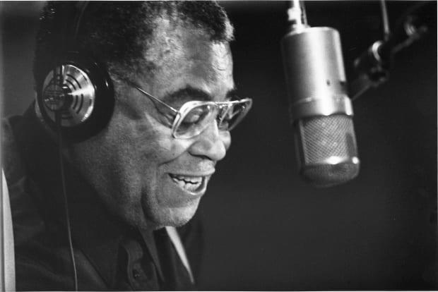 Close-up of American actor James Earl Jones, headphones on his head, as he speaks in a microphone in a recording studio, Hollywood, California, July 10, 1991.<p>Edmund Eckstein/Getty Images</p>