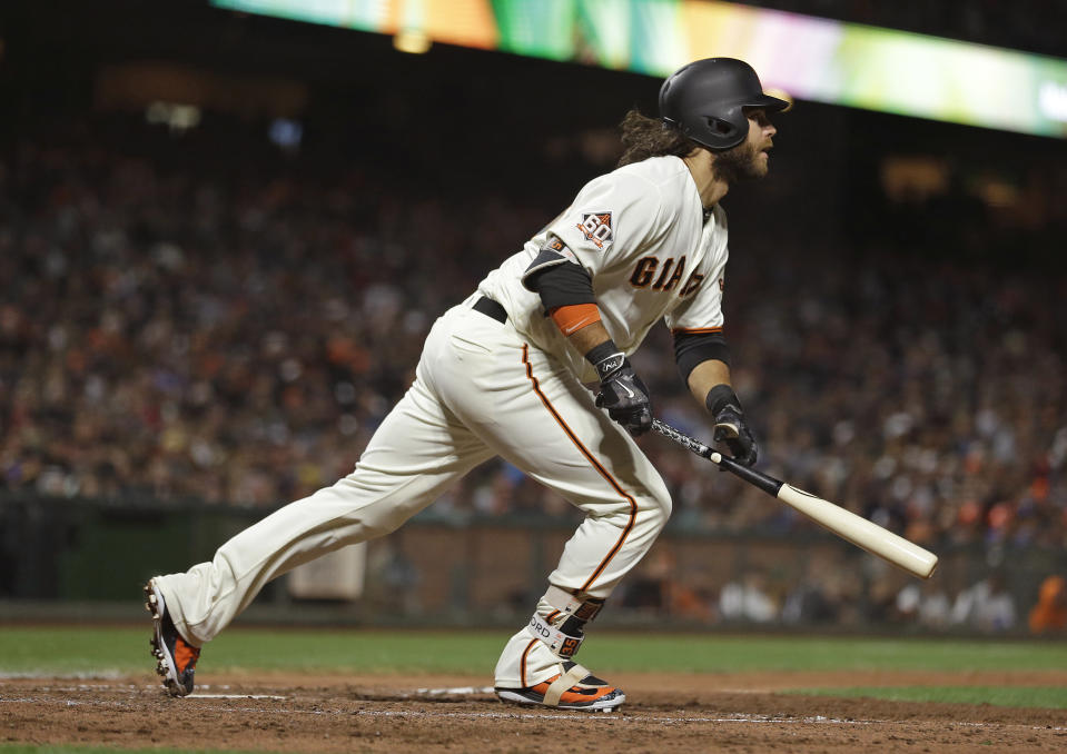 San Francisco Giants' Brandon Crawford follows a home run he hit off Houston Astros starting pitcher Charlie Morton to right field in the sixth inning of a baseball game Monday, Aug. 6, 2018, in San Francisco. (AP Photo/Eric Risberg)